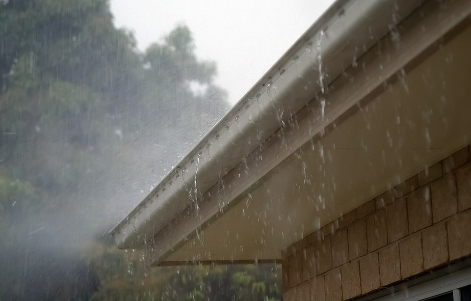 An image of rain falling on a roof.