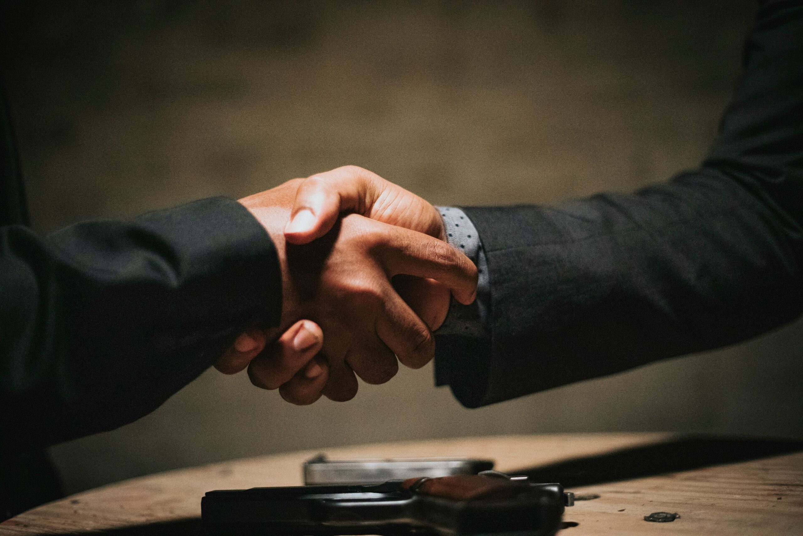 2 men shaking hands over roofing in Redditch deal